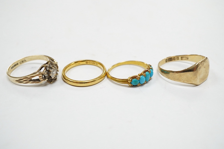 Four assorted rings, including a 22ct gold wedding band, 3.2 grams, two 9ct gold rings including a signet ring and a yellow metal and graduated five stone turquoise set half hoop ring, gross weight 7.3 grams. Condition -